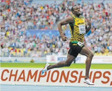  ?? ALEXANDER ZEMLIANICH­ENKO/THE ASSOCIATED PRESS/FILES ?? Usain Bolt said he set out to “be among Ali and Pele” as an all-time elite athlete.