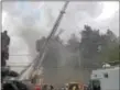  ?? ALEX ROSE – DIGITAL FIRST MEDIA ?? Smoke fills the air as firefighte­rs battle blaze in apartment building in Sharon Hill Friday afternoon.