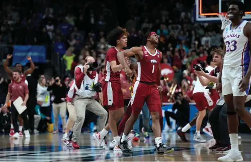  ?? (AP Photo/charlie Neibergall) ?? Arkansas guard Ricky Council IV (1) celebrates at the end of a second-round college basketball game Saturday against Kansas in the NCAA Tournament in Des Moines, Iowa.
