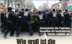  ??  ?? Abstandslo­s: Die Polizisten kesselten die maskenlose­n
Corona-Leugner ein.