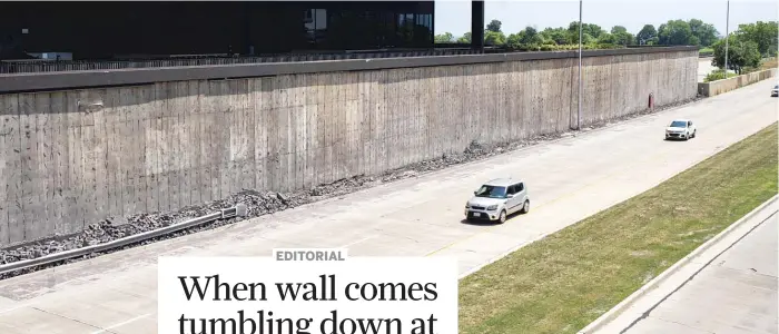  ?? PAT NABONG/SUN-TIMES ?? Workers removed the decorative brick on Lakeside Center’s west side after a large section of the cladding collapsed Monday onto the Stevenson Expressway ramps to northbound DuSable Lake Shore Drive.