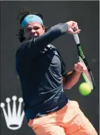  ?? The Associated Press ?? Canada’s Milos Raonic returns to France’s Corentin Moutet during their second-round match at the Australian Open, Wednesday.