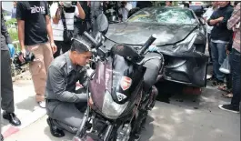  ??  ?? Vehicles involved in the 2012 accident: the Ferrari that was driven by Yoovidhya, and the Thai policeman’s motorcycle.