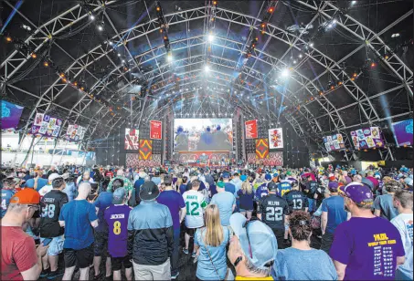  ?? Chase Stevens Las Vegas Review-Journal @csstevensp­hoto ?? Fans watch as the fourth round of the NFL draft begins Saturday. Las Vegas and the NFL will showcase themselves again in 2024 when Super Bowl LVIII arrives.