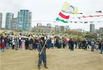  ?? (Aziz Taher/Reuters) ?? A KURDISH man carries a flag with a portrait of jailed PKK leader Abdullah Ocalan during Nowruz festival celebratio­ns in Beirut, in March.