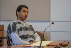  ?? ERIC BONZAR — THE MORNING JOURNAL ?? Eighteen-year-old Darius Ramey, of Lorain, appears in Lorain County Common Pleas Court Judge John R. Miraldi’s courtroom, April 27. After signing a plea agreement, Miraldi sentenced Ramey to 21 years in prison for the July 11, 2016 shooting death of...