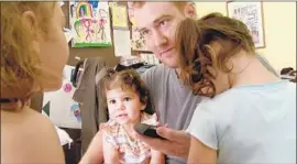  ?? HBO ?? MEMBERS of the Shank family, daughters Autumn, left, and Annalis, father Adam and middle daughter Ava, talk on the phone with imprisoned mom Cynthia.