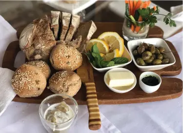  ??  ?? ENJOY FRESHLY baked bread with Beth and Dan in Moshav Kisalon. LEFT: TAKE part in a cooking workshop at the farm.