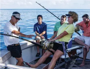  ??  ?? Capt. Peter B. Wright (above, on left) teaches the correct heavy-tackle technique during an Australian session of Marlin University in 2014.