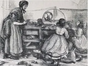  ??  ?? A woman uses a box mangle – rollers run back and forth across damp clothes, which are spread on a flat, polished surface