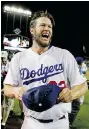  ?? CHRIS CARLSON/ The Associated Press ?? L.A. pitcher Clayton Kershaw celebrates his no hitter against the Colorado Rockies post-game in Los Angeles. He struckout 15 batters.
