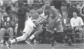  ?? GEOFF BURKE/USA TODAY SPORTS ?? Wizards guard John Wall (left) dribbles the ball as Celtics guard Isaiah Thomas defends in the first quarter in Game 3 of the second round of the playoffs Thursday in Washington.