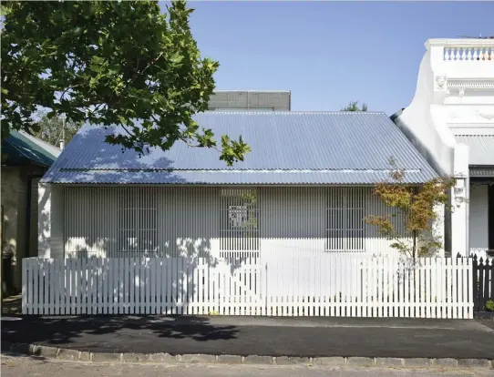  ??  ?? Rob Kennon Architects liberated new spatial possibilit­ies for the site of Fitzroy North House 02 (2019) by disguising the front as a traditiona­l worker’s cottage. Photograph: Derek Swalwell.