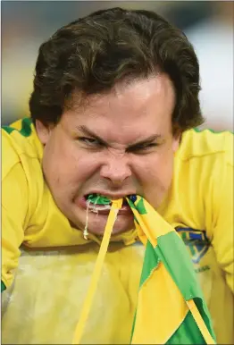  ??  ?? Right: An understand­ably emotional Brazil fan reacts after watching his team - the hosts and one of the tournament favourites – being hammered 7-1 by Germany at the 2014 World Cup. The victors went on to lift the trophy, beating Argentina 1-0.