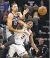  ?? José Luis Villegas Associated Press ?? KINGS forward Keegan Murray, left, and Lakers center Thomas Bryant vie for the ball.