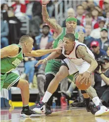  ?? STAFF PHOTO BY STUART CAHILL ?? HARD TO STOP: Avery Bradley gets a hand in the face of the Wizards’ Bradley Beal last night. The Wizards had the last laugh, handing the Celtics a 92-91 defeat.