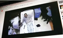  ??  ?? A video clip shows China's jailed Nobel Peace laureate Liu Xiaobo lying on a bed receiving medical treatment at a hospital on a computer screen in Beijing, in this June 29 file photo. (AP)