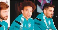  ?? — AFP ?? (Ltor) Germany’s Marvin Plattenhar­dt, Leroy Sane and Ilkay Gundogan address a press conference of the German national football team in Berlin.