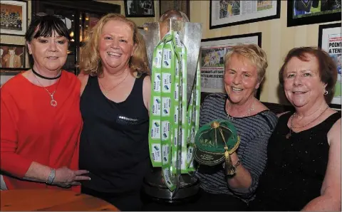  ??  ?? Sisters.......Bernadette, Maeve and Phyllis with their sister Paula Brennan at the surprise presentati­on to Paula of her 11 WFAI Internatio­nal Caps held in Clarke’s Bar.