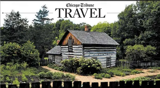  ??  ?? Vegetable and flower gardens grow around log homes at Old World Wisconsin, about 40 miles west of Milwaukee.