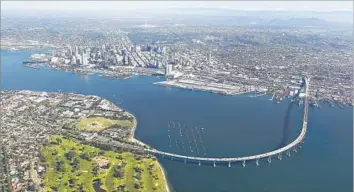  ?? Photograph­s by K.C. Alfred San Diego Union-Tribune ?? A REPORT outlined three possible ways to cross the bridge on bike or foot, including via a tube through the San Diego-Coronado Bridge’s arch supports. The cost might require the return of toll charges.