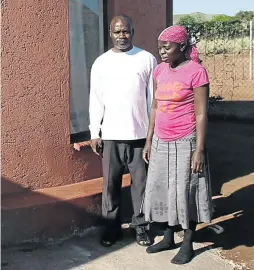  ?? /ANTONIO MUCHAVE ?? Benneth Mabunda and his partner, Funzani Mbedzi, stand on the grave of their 18-month-old child Tshedza, who died of malaria last week in Giyani, Limpopo. The baby was buried next to their home in Thomo village.