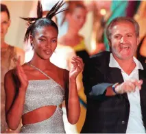  ??  ?? Photo shows Italian designer Gianni Versace (right) and Naomi Campbell after a fashion show in Paris. — AFP photos