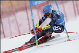  ?? ALESSANDRO TROVATI — THE ASSOCIATED PRESS ?? American Mikaela Shiffrin speeds toward her record-breaking women's World Cup giant slalom victory in Kronplatz, Italy on Tuesday.