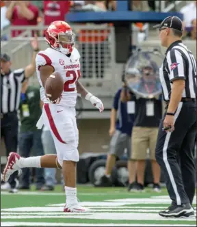  ?? NWA Democrat-Gazette/Ben Goff ?? RUNNING GAME: Arkansas running back Devwah Whaley scores a touchdown in the second quarter Saturday in Fort Collins, Colo., during the Razorbacks’ 34-27 loss at Colorado State.