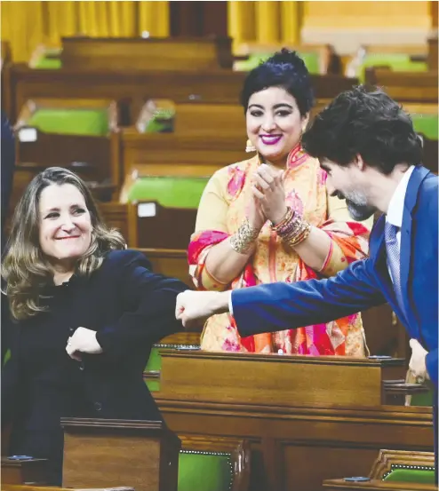  ?? Sean Kilpat rick / the cana dian press ?? Minister of Finance Chrystia Freeland gets a fist bump from Prime Minister Justin Trudeau after delivering the 2020 fall fiscal update in the House of Commons on Monday. Her statement foresees a deficit of up to $399 billion in 2021.