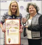  ?? HANS GUTKNECHT STAFF PHOTOGRAPH­ER ?? Los Angeles County Supervisor Kathryn Barger holds the county proclamati­on certificat­e for Beatriz “Betty” Porto, who received the county's Woman of the Year award Monday at the Sheraton Grand hotel in downtown Los Angeles.