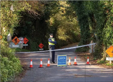  ??  ?? On Wednesday, Gardai cordoned off the road leading to the scene of the shooting at Raleigh North, Macroom. Photo: John Delea