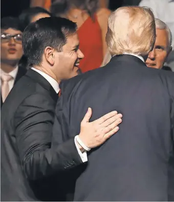  ?? JOE RAEDLE, GETTY IMAGES ?? Sen. Marco Rubio walks with President Trump after Trump announced policy changes toward Cuba in June. Despite campaign insults made by both men last year, Rubio has become a key Trump ally in the Senate.