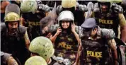  ?? PTI ?? Journalist Kavitha Jakkal being escorted by the police to Sabarimala Temple