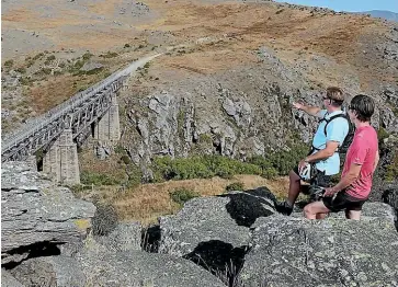  ?? ?? The Otago Central Rail Trail follows the path of the demolished railway that linked Clyde with Dunedin. It is now regarded as one of the South Island’s top tourist attraction­s.