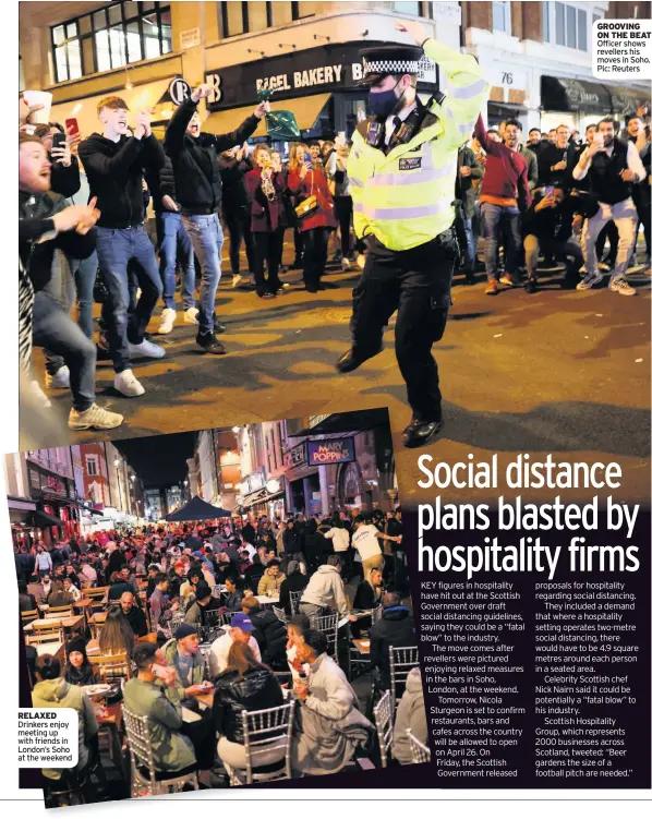  ??  ?? RELAXED Drinkers enjoy meeting up with friends in London’s Soho at the weekend
GROOVING ON THE BEAT Officer shows revellers his moves in Soho. Pic: Reuters