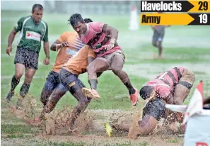  ??  ?? Both teams had to fight the weather - Pic by Amila Gamage