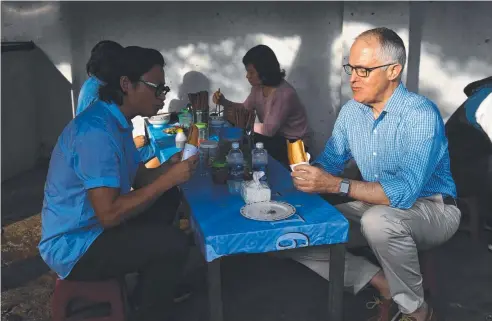  ??  ?? LOCAL CUISINE: Malcolm Turnbull spends the morning in the Vietnam town of Da Nang, eating a “breakfast of champions” alongside Australian-Vietnamese celebrity chef Luke Nguyen. The Prime Minister, who is in Vietnam for the APEC summit, faces a...