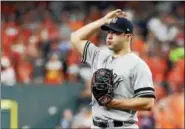  ?? PHOTO BY ELSA/GETTY IMAGES ?? Tommy Kahnle #48of the New York Yankees reacts against the Houston Astros during the fourth inning in Game Seven of the American League Championsh­ip Series at Minute Maid Park on October 21, 2017in Houston, Texas.