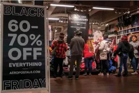  ?? Photograph: Mark Ralston/AFP/Getty Images ?? Shoppers look for Black Friday deals on 28 November 2019 at a store in Los Angeles, California.