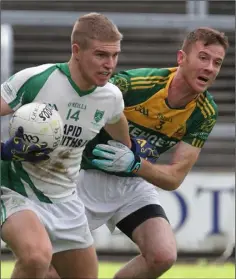  ??  ?? Sam Kelly of Crossabeg-Ballymurn holding off HWH-Bunclody joint captain Colm Farrell in the Ashdown Park/Amber Springs Hotels Intermedia­te football championsh­ip final on Saturday.
