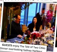  ??  ?? GUESTS enjoy TheTale of Two Cities Dinner overlookin­gSydney Harbour.