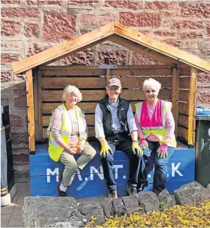  ?? ?? Rest stop Volunteers make use of the bench trail during a recent litter pick