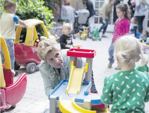  ?? CHRIS YOUNG / THE CANADIAN PRESS FILES ?? Ontario Liberal Leader Kathleen Wynne visits a daycare in Toronto earlier this month. The Liberals propose fully covered childcare for all children from age 21/2 to four, starting in 2020.