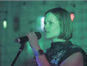  ?? ?? ON SONG: Tegan Fry sings for a crowd of more than 160 people at Horsham City Oval clubrooms during the fundraiser on Saturday night. Pictures: PAUL CARRACHER