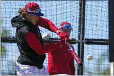  ?? DAVID J. PHILLIP — THE ASSOCIATED PRESS ?? Philadelph­ia Phillies third baseman Alec Bohm hits during a spring training baseball workout on Tuesday.