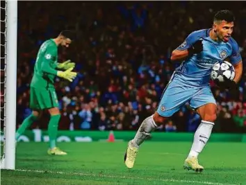  ?? AP ?? Top: Manchester City’s Sergio Aguero celebrates after scoring his side’s second goal in the 58th minute during the Champions League Round of 16 first leg match between City and Monaco at the Etihad Stadium on Tuesday night.