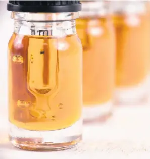 ??  ?? > Cannabis oil is being increasing­ly used to alleviate a range of medical problems