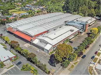  ??  ?? Foodstuffs North Island’s distributi­on centre in Upper Hutt which has been sold to Farrah’s. Below, Jovan Canak and his wife Farrah, of the food exporting business.