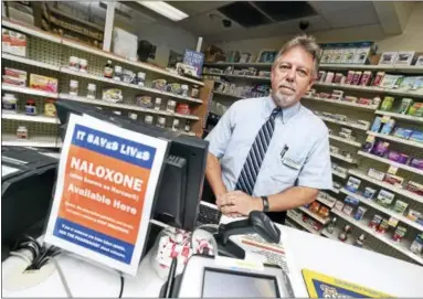  ?? ARNOLD GOLD / HEARST CONNECTICU­T MEDIA ?? Ed Funaro Jr., director of Visels Pharmacy, behind the counter at his 714 Dixwell Ave., New Haven, pharmacy.